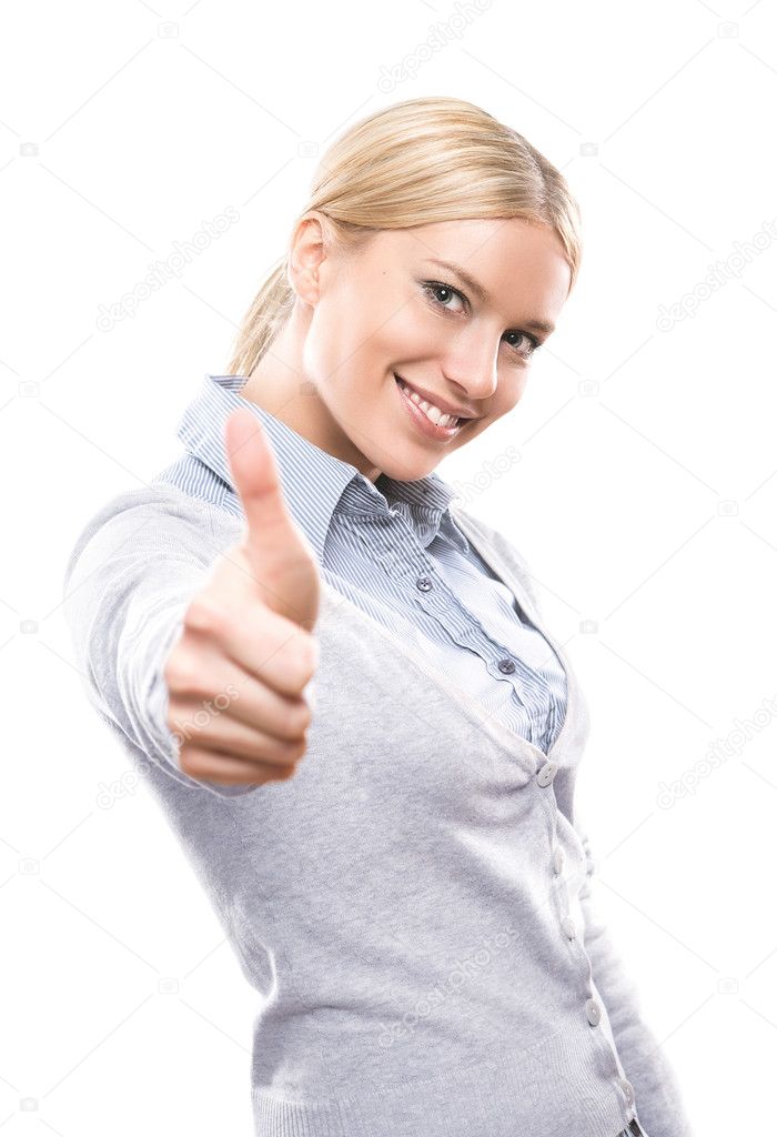 Cute young woman showing thumbs up