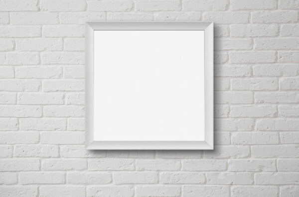 Blank picture frame at the white brick wall with copy space and clipping path