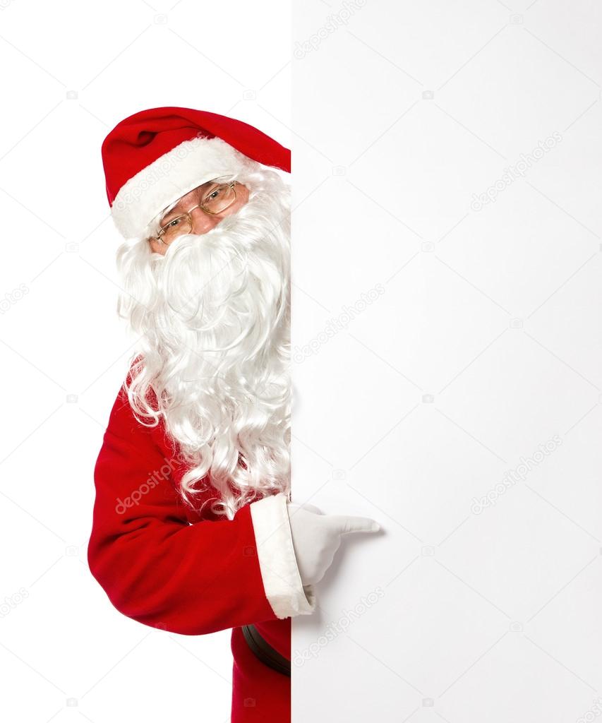 Santa Claus pointing on a blank banner