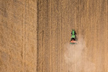 High angle view of a tractor on the field with copy space