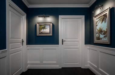 Empty hallway with elegant wooden moulding panels on the wall clipart