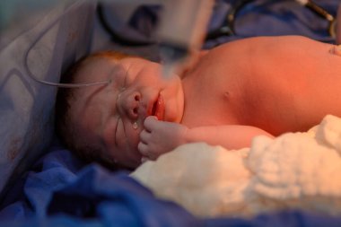 Medical examination of the newborn in the first few minutes of life.