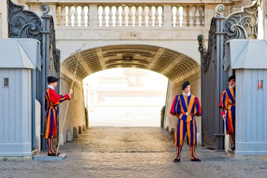 Famous Swiss Guard guarding the entrance to the Vatican City clipart