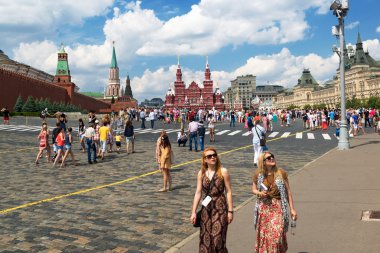 Tourists visiting the Red Square on july 13, 2013 in Moscow, Rus clipart