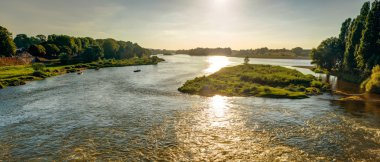 View of the Loire at sunset in Amboise, France clipart