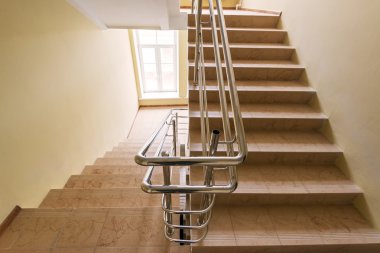 Staircase with metallic handrails clipart