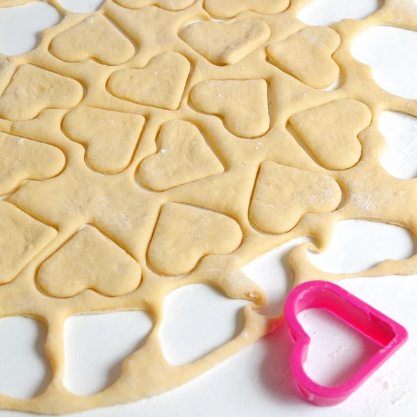 Baking heart cookies for valentines — Stock Photo, Image