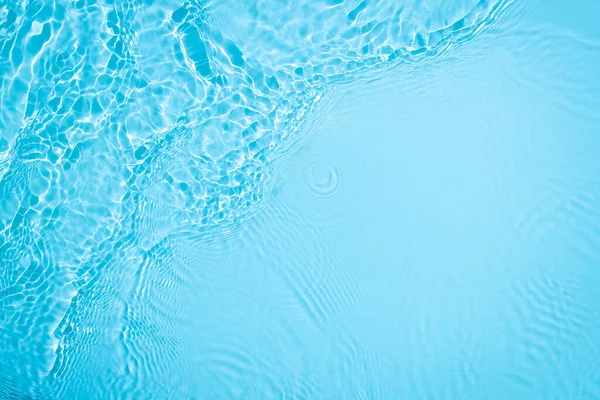Transparent blue colored clear calm water surface texture — Stock Photo, Image