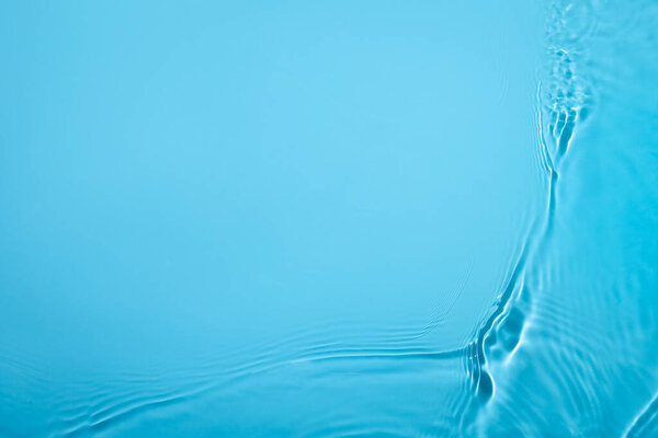 transparent blue colored clear calm water surface texture 