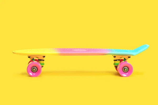 Arco-íris plástico Penny placa skate isolado no fundo amarelo — Fotografia de Stock