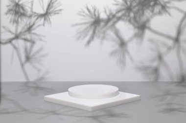 Gri arkaplanlı gölgeli beyaz podyumlu sahne