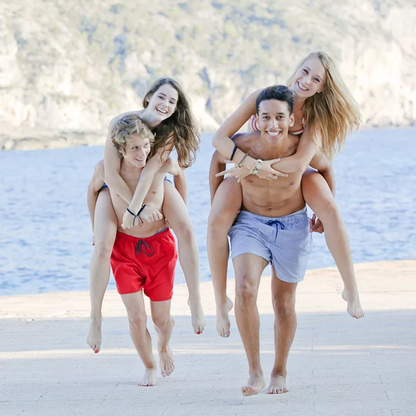 Piggyback teens summer camp games — Stock Photo, Image