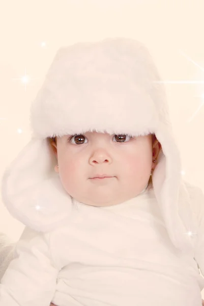 Cute baby in furry hat — Stock Photo, Image