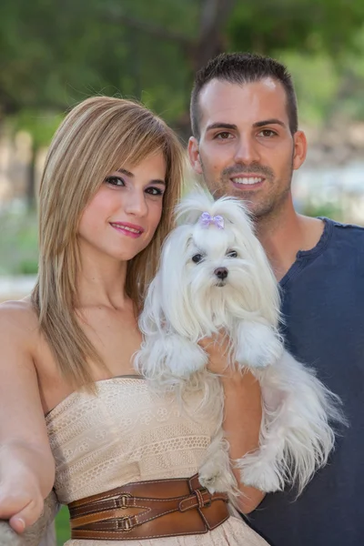 People with pet Maltese dog — Stock Photo, Image