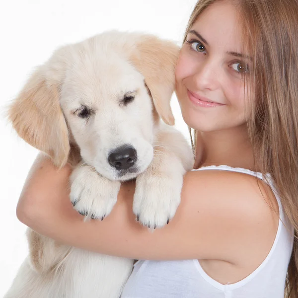 Girl holding pet labrador puppy — Stock Photo, Image