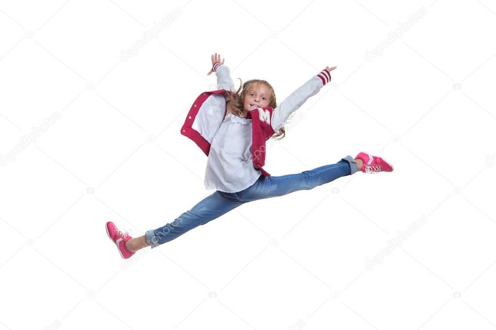 fit healthy young girl doing ballet leap