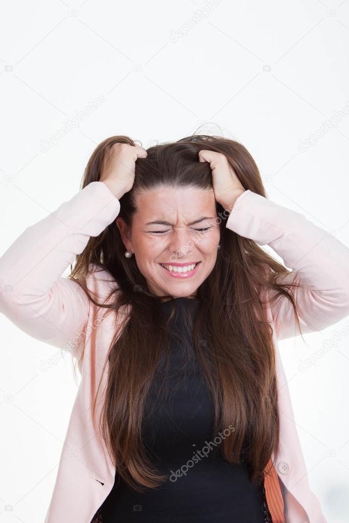 frustrated annoyed woman tearing hair out
