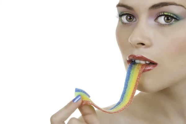 Woman with makeup eating sweets or candy — Stock Photo, Image