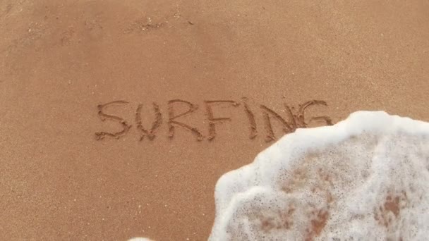 Surfing Lettering Sand Washes Away Sea Water — Stockvideo