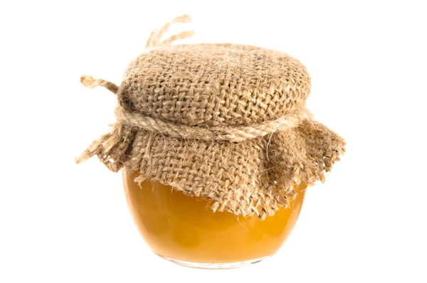 Jar of honey, it is isolated on white — Stock Photo, Image