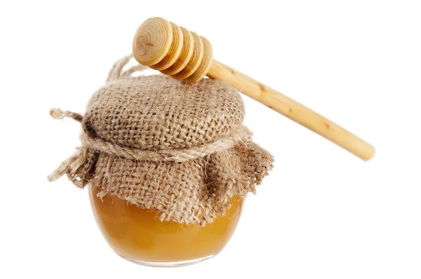 Sklenice medu, je izolované na bílém — Stock fotografie