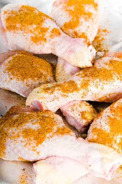 Spiced chicken legs on the foil — Stock Photo, Image