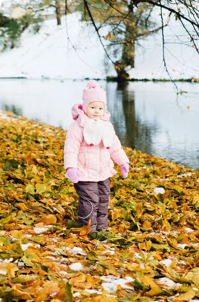 A little girl walks in autumn Park — Stock Photo, Image