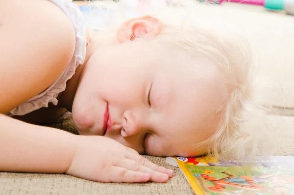 Little girl fell asleep after playing — Stock Photo, Image