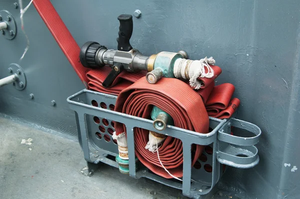 Fire hose on a deck of the ship — Stock Photo, Image