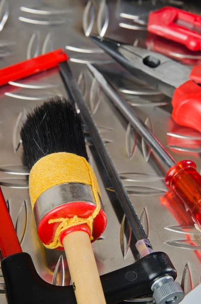 Set of working tools on a metal surface — Stock Photo, Image