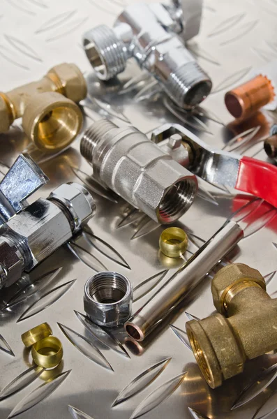 Plumbing Kit on a metal surface — Stock Photo, Image