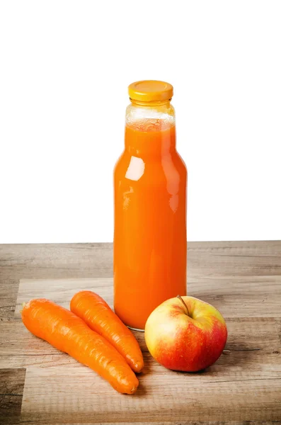 Bottle with carrots juice and an apple — Stock Photo, Image