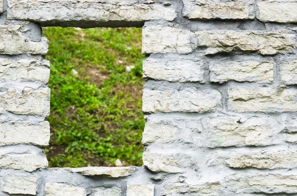 Window aperture in a wall from calcareous stones, a close up — Stock Photo, Image