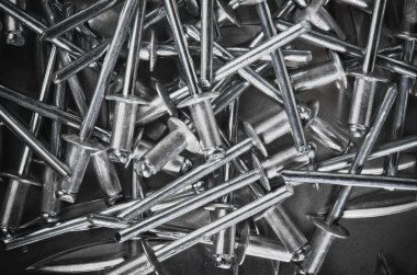 Aluminium assembly rivets, close up clipart