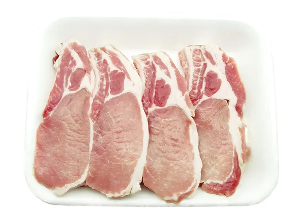 Chuletas de cerdo envasadas en un recipiente —  Fotos de Stock