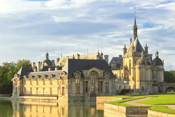 Castle of Chantilly at sunset. France — Stock Photo, Image