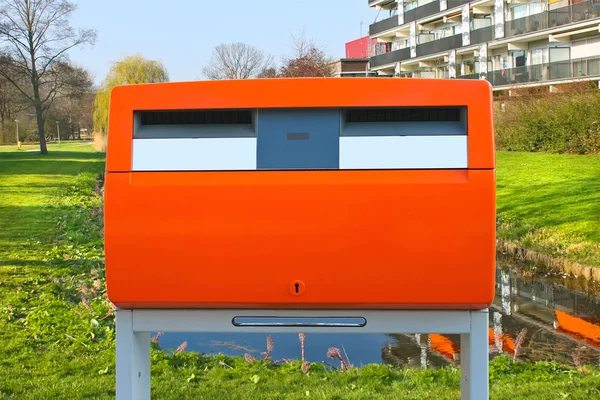 Dutch public orange mailbox on a city street. Netherlands — Stock Photo, Image