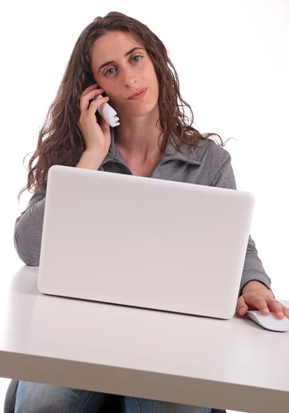 Woman with phone and computer — Stock Photo, Image