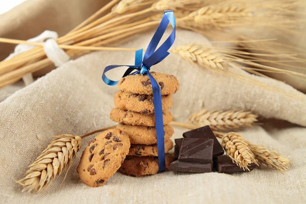 Gourmet cookies with blue ribbon — Stock Photo, Image