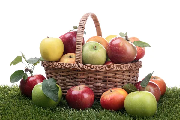 Wicker basket with apples — Stock Photo, Image