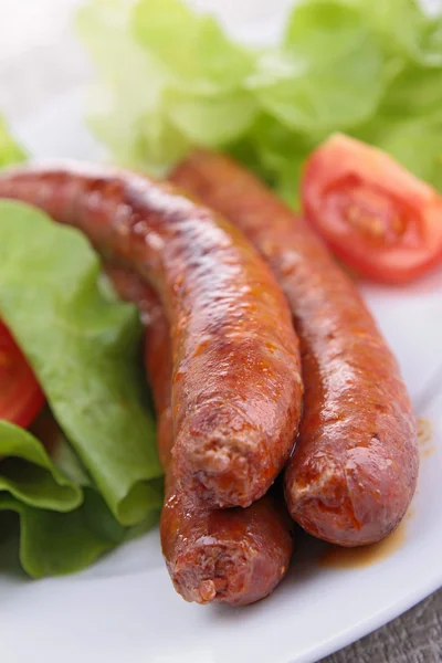 Grilled sausage and salad — Stock Photo, Image