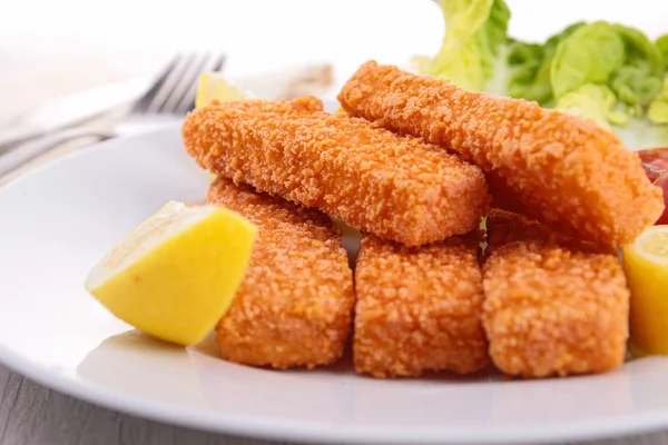 Fish fingers with garnish Royalty Free Stock Photos