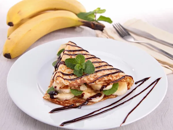 Banana crepe with chocolate — Stock Photo, Image