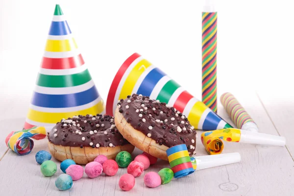 Chocolate donuts with carnival decoration — Stock Photo, Image