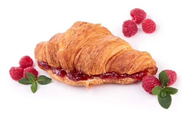 Isolated croissant with raspberries — Stock Photo, Image