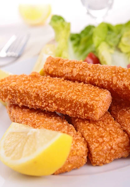 Fish fingers and lemon — Stock Photo, Image