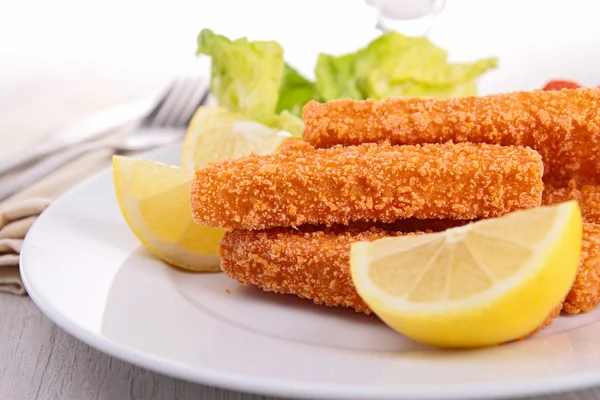 Палець риби і лимон — стокове фото