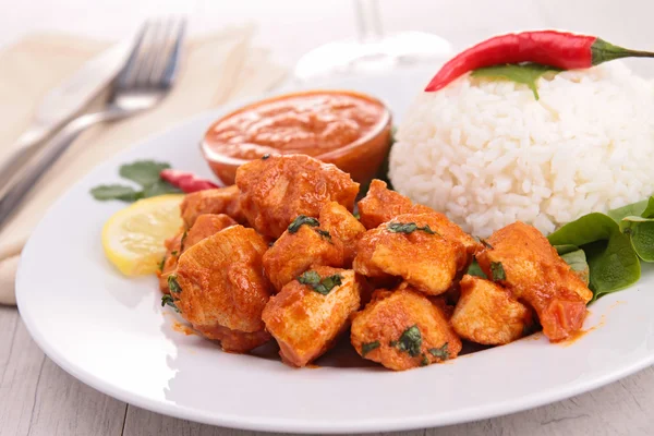 Chicken cooked with curry and coconut with rice — Stock Photo, Image