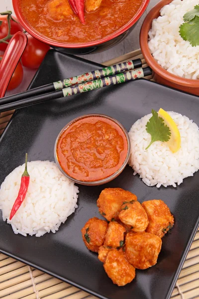 Rice and red curry sauce — Stock Photo, Image