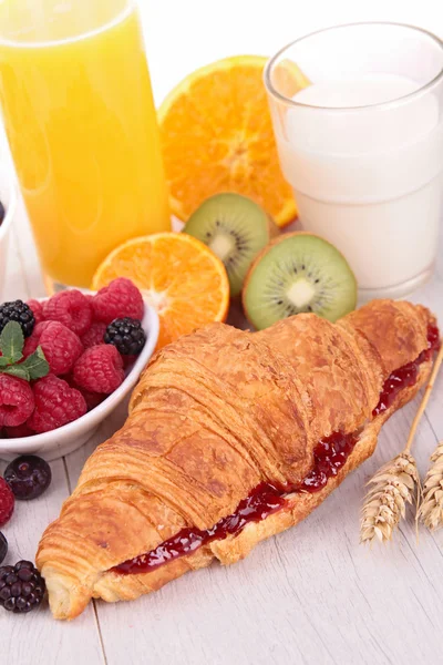 Breakfast with croissant and fruits — Stock Photo, Image